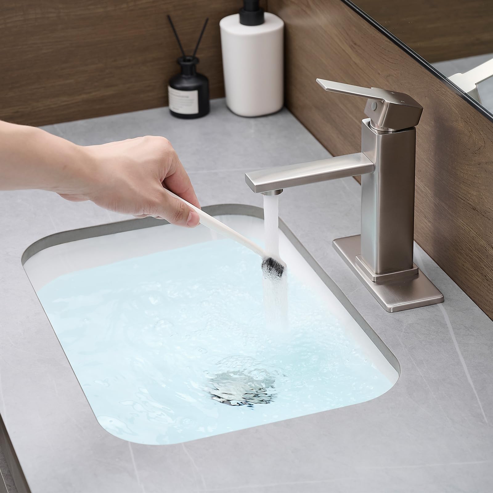 YXOCVIR brushed-nickel bathroom faucet with pop-up drain for a clean countertop.