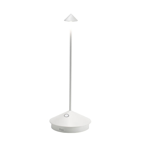 Zafferano Pina Pro lamp on charging base for cordless use.