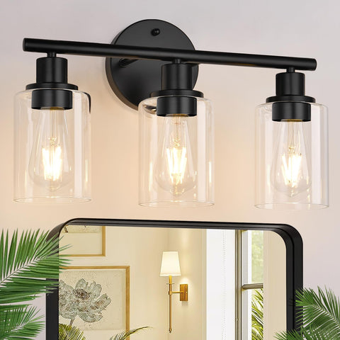 Zarbitta 3-light bathroom fixture in matte black with clear glass shades over the mirror
