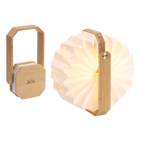 ZBOLE lamp on a bedside table creating a cozy reading mood.