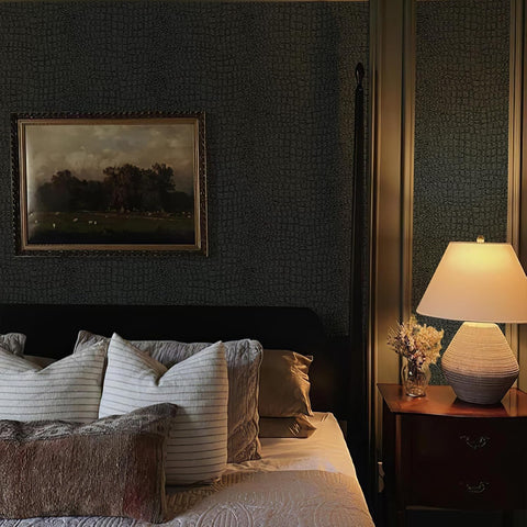 Matte black vinyl wallpaper adheres to drywall, cabinets, and shelves.