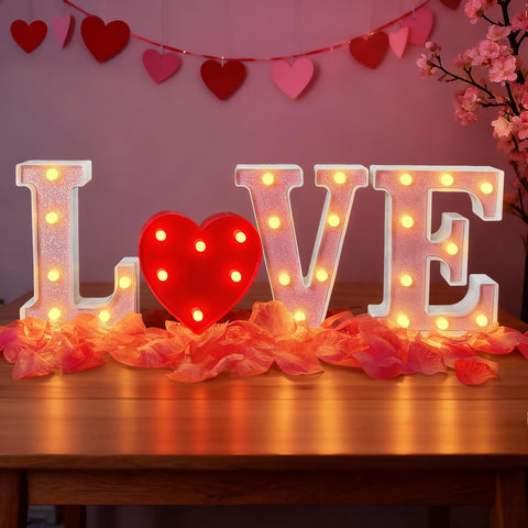 Zhaoray love sign L letter glows warmly on tabletop.