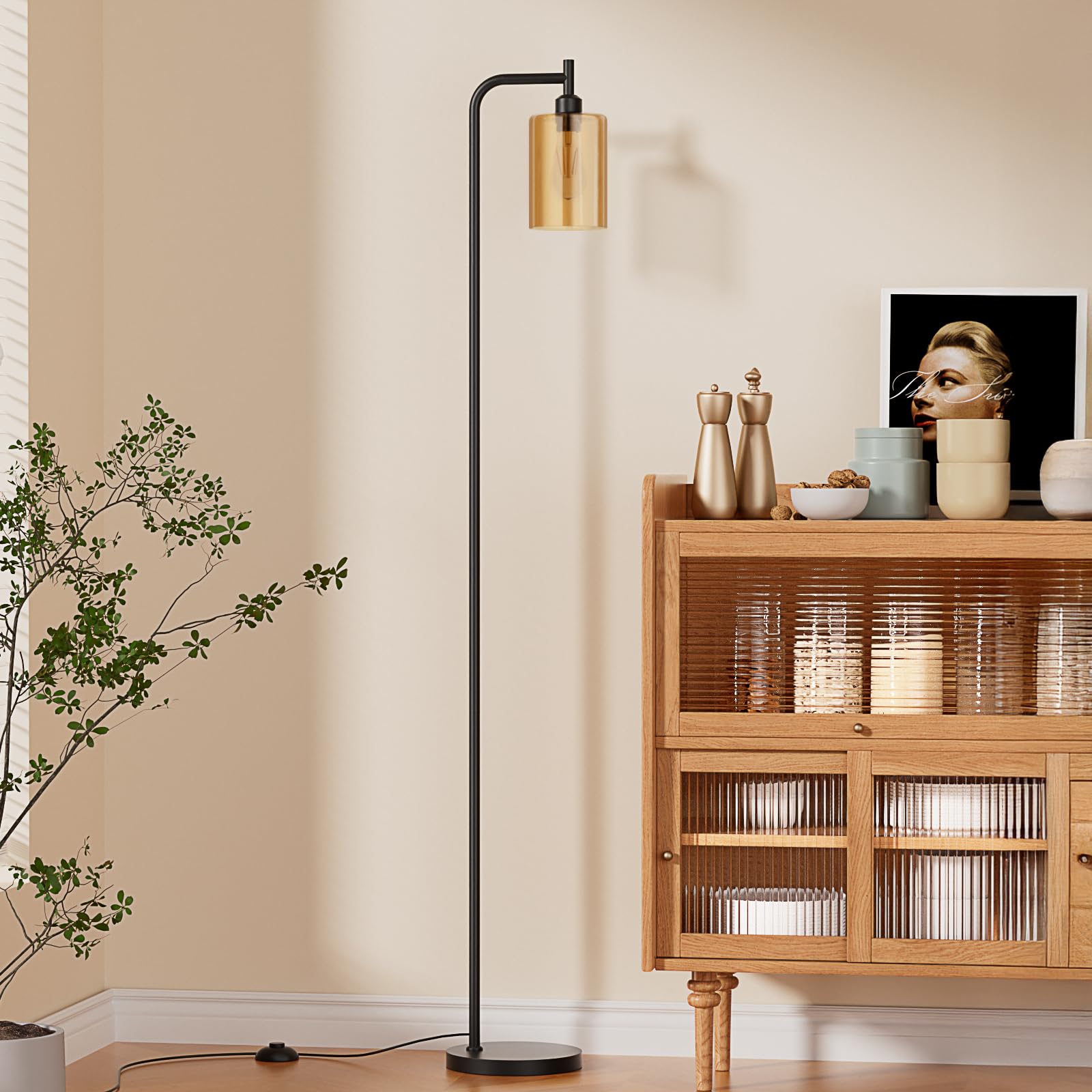 Ziisee floor lamp with amber glass shade adds warm ambience to the living room.
