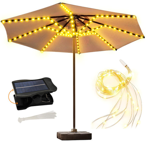 ZNYCYE solar umbrella lights glow warmly on a patio umbrella for cozy evenings.