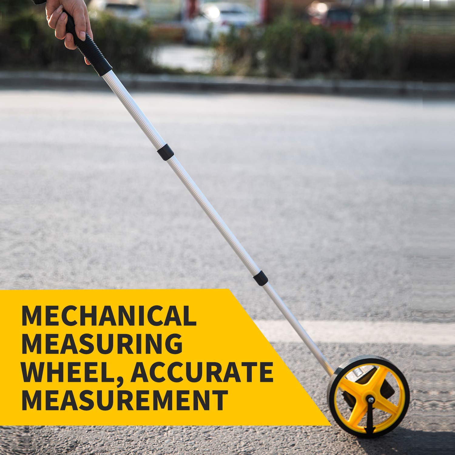 Zozen measuring wheel used in outdoor field work for precise boundary checks